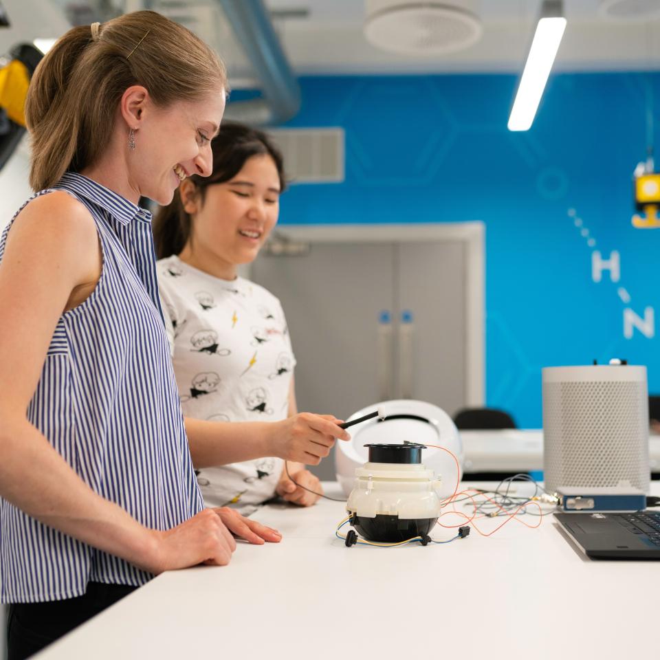 Two women working together at a lab bench