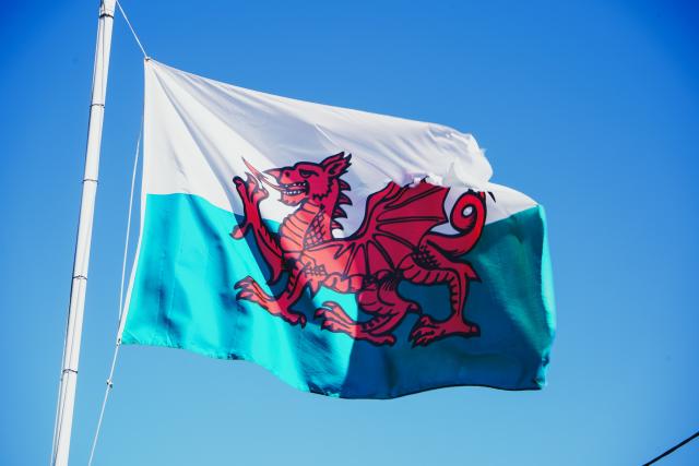 Welsh flag against a blue sky
