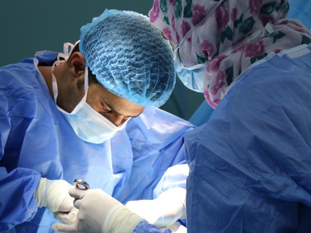 Two surgeons undertaking an operation