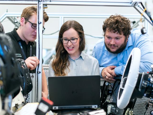 2 men and a woman working in engineering