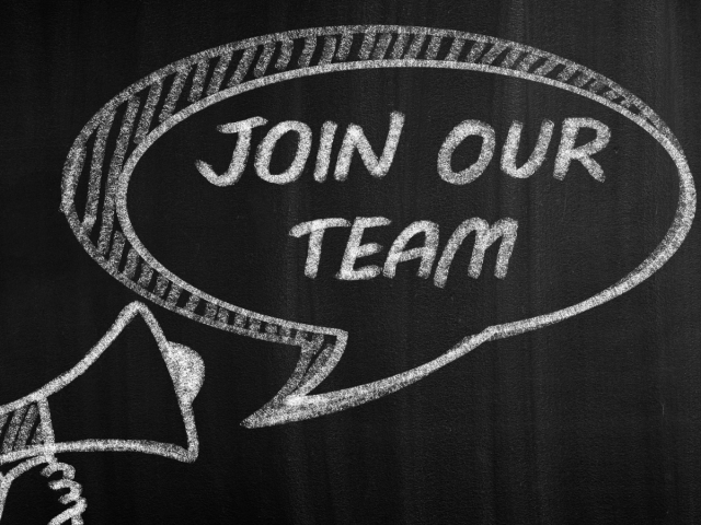 Black background with a white loudspeaker and speech bubble saying 'Join our team'