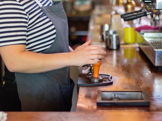 Person working in a coffee shop