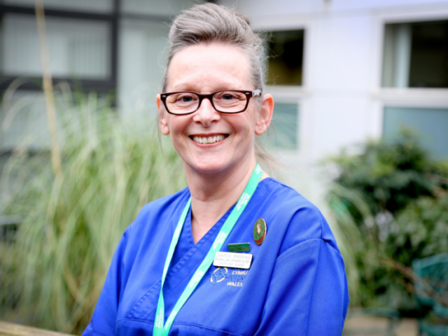 Photo of Sharon Manning wearing nursing scrubs