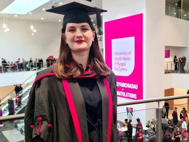 Photo of Antigone in graduation cap and gown